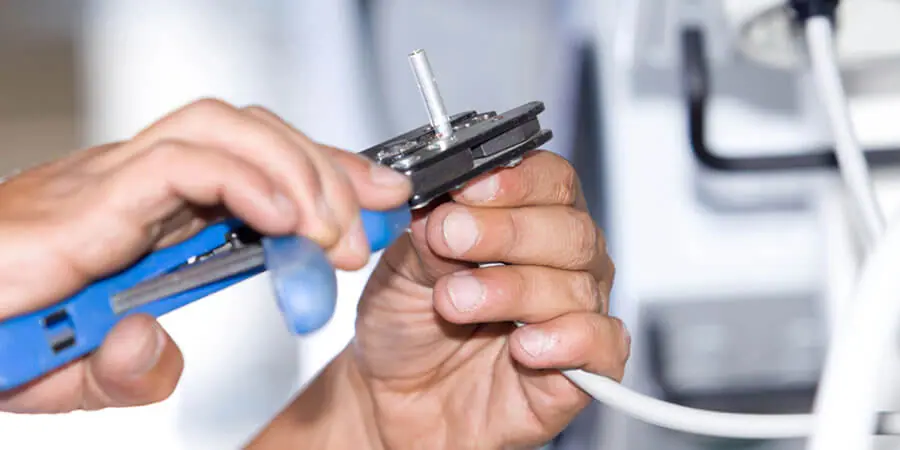 Service technician performing electrical writing services